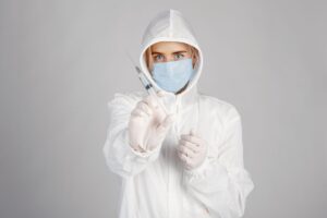 Healthcare professional in full protective gear preparing for Ebola outbreak response