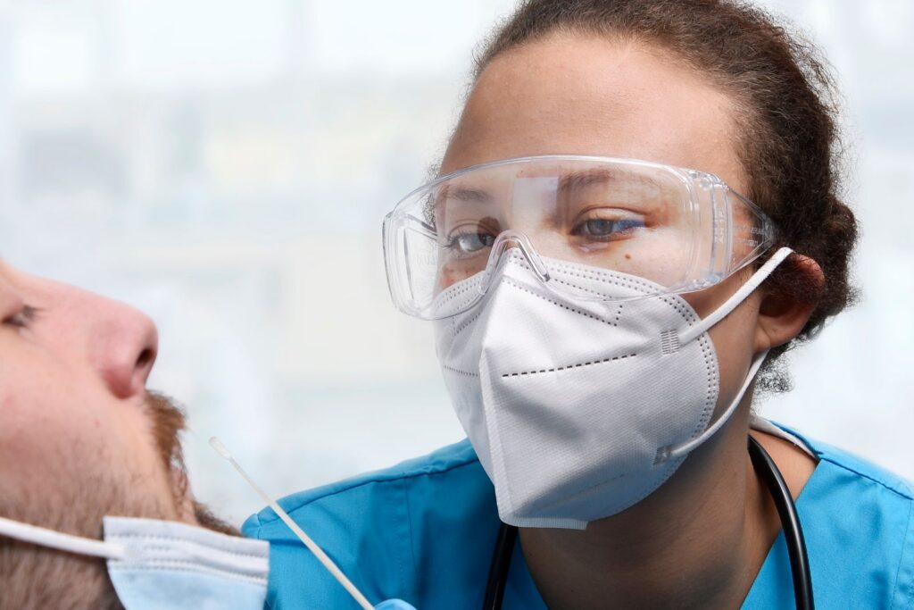 Healthcare worker performing a COVID-19 PCR test
