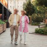 Active senior couple walking outdoors for brain health