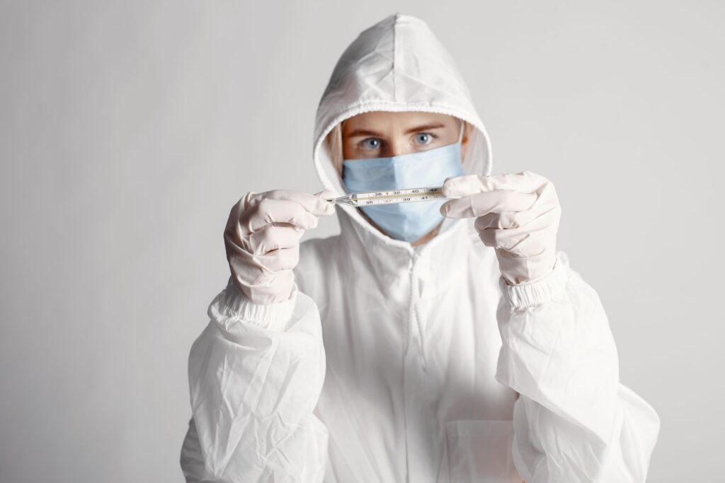 Healthcare worker in full protective suit responding to the Ebola outbreak in DR Congo