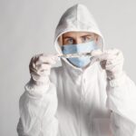 Healthcare worker in full protective suit responding to the Ebola outbreak in DR Congo