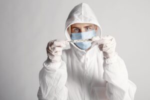 Healthcare worker in full protective suit responding to the Ebola outbreak in DR Congo
