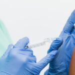 Nurse administering an mRNA flu vaccine