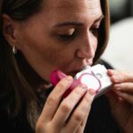 Woman using an inhaler for asthma relief