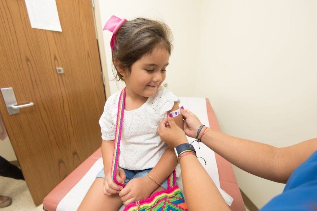 Child receiving MMR vaccination at a clinic